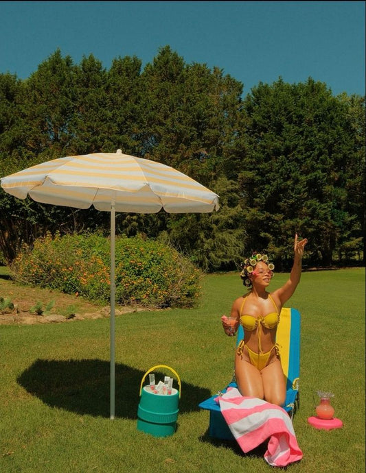 Woman enjoying summer in Spring, TX showing smooth, glowing skin after waxing at Beauty Bar by Mare