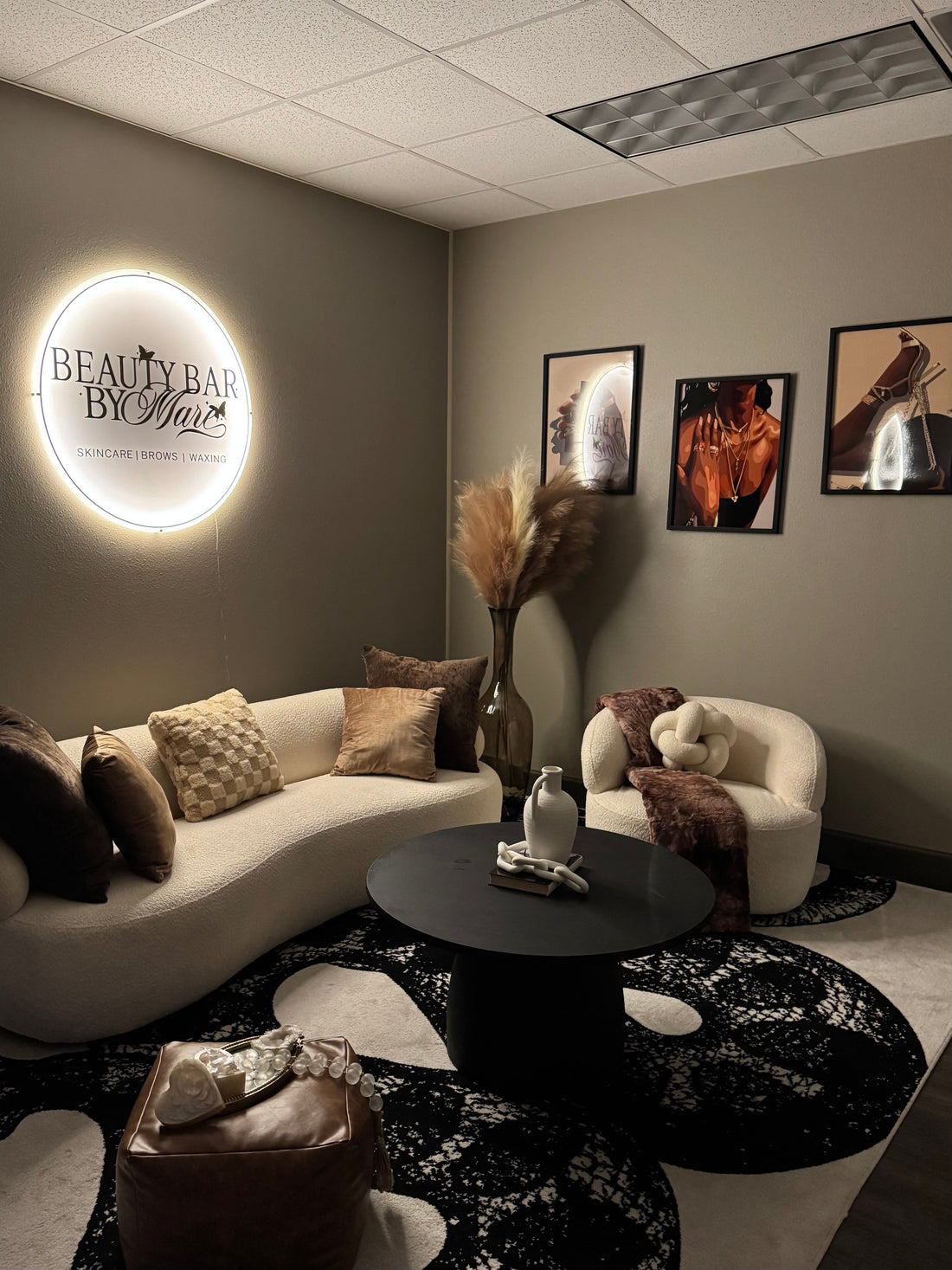 Cozy interior of Beauty Bar by Mare waxing studio in Spring Texas, showing reception and ambient lighting.
