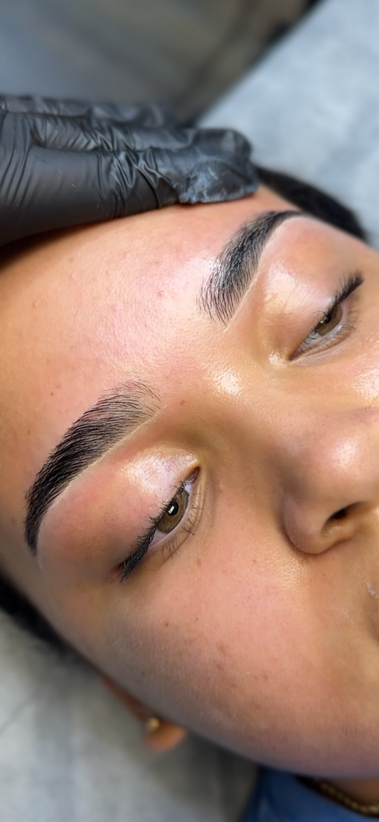 Client getting a eyebrow wax at Beauty Bar by Mare, ready for Thanksgiving holiday