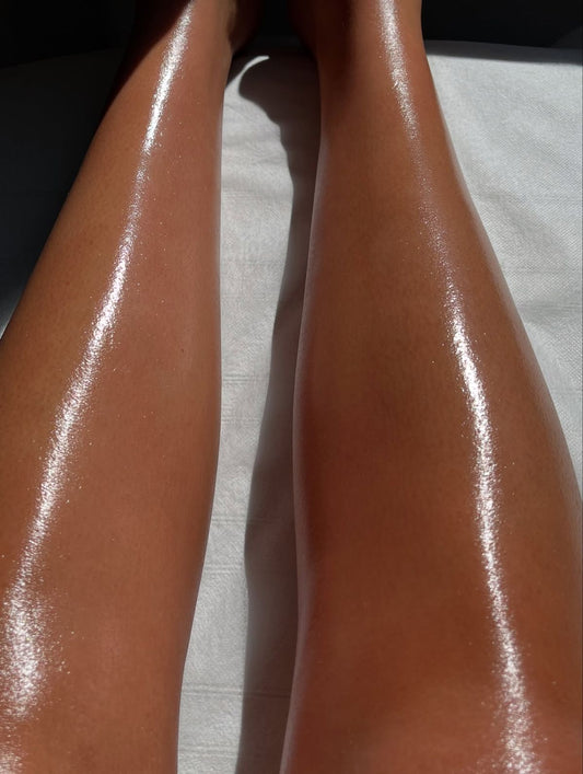 Client receiving a Brazilian wax in a relaxing winter-themed treatment room.